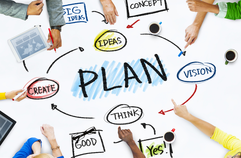 Group of Business People in a Meeting About Planning Group of Business People in a Meeting About Planning